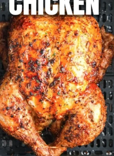 Air Fryer whole roasted chicken garnished and ready to serve