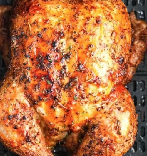 Air Fryer whole roasted chicken garnished and ready to serve