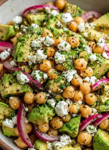 Colorful Chickpea Feta Avocado Salad in a bowl.