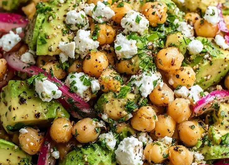Colorful Chickpea Feta Avocado Salad in a bowl.