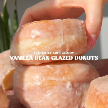 Delicious homemade glazed donuts with a shiny icing on a plate