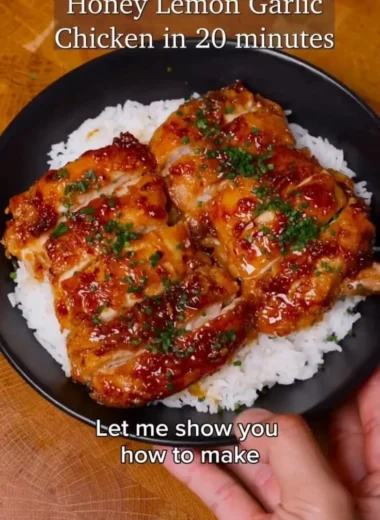 Delicious Honey Lemon Garlic Chicken garnished with fresh herbs.