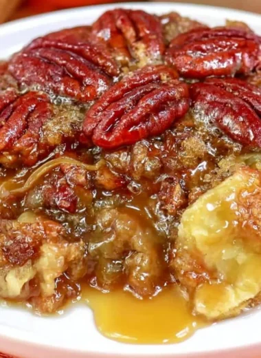 Delicious slice of Dixie's Pecan Pie Cobbler with a golden crust and pecans