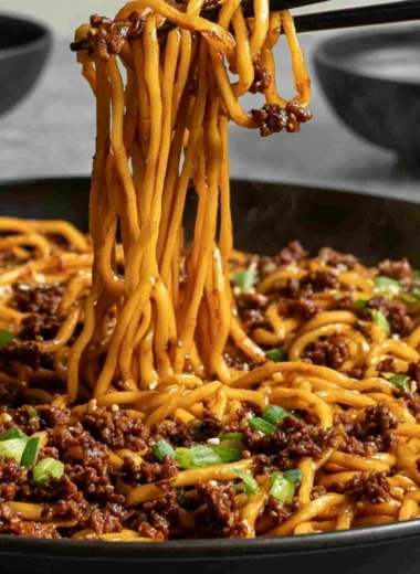 Bowl of easy Mongolian ground beef noodles topped with green onions