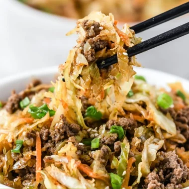 Bowl of egg roll ingredients with vibrant vegetables and protein, ready to serve.