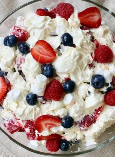 Red White and Blue Cheesecake Salad with fresh berries and creamy cheesecake.