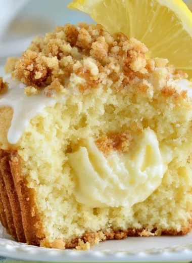 Freshly baked soft lemon muffins on a cooling rack