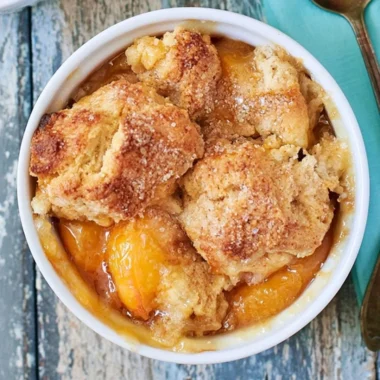 Delicious Southern peach cobbler served in a rustic dish.