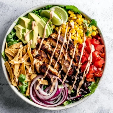 Bowl of Southwest Avocado Chicken Salad with colorful vegetables and chicken