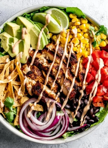 Bowl of Southwest Avocado Chicken Salad with colorful vegetables and chicken