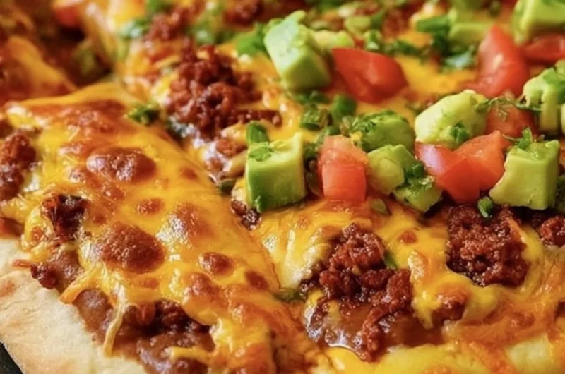 Delicious Taco Pizza topped with fresh ingredients and spices