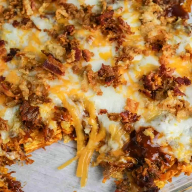 BBQ Bacon Cheeseburger Frito Pie with crispy bacon and melted cheese