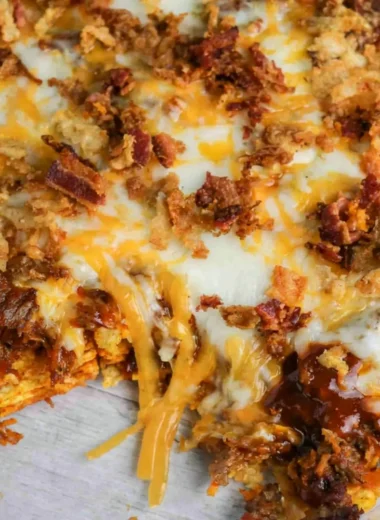 BBQ Bacon Cheeseburger Frito Pie with crispy bacon and melted cheese