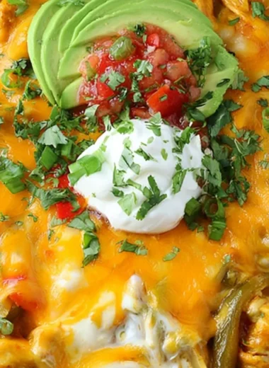 Cheesy chicken fajitas casserole served in a dish with colorful peppers and cheese