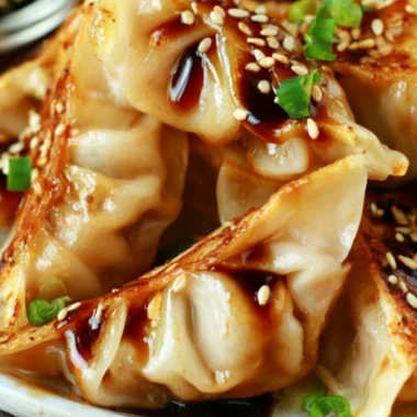 Homemade chicken potstickers filled with chicken and vegetables on a plate.