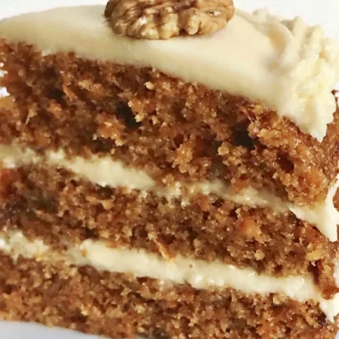 Classic carrot cake with cream cheese frosting and walnuts
