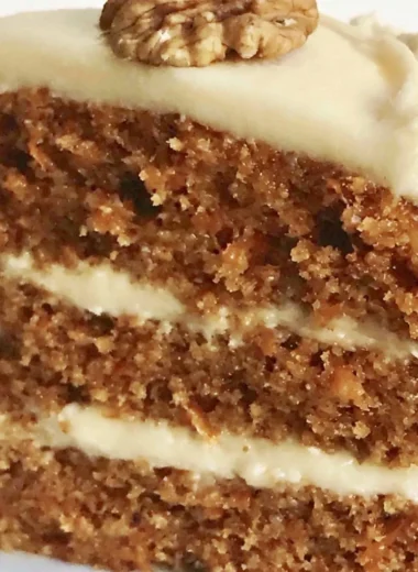 Classic carrot cake with cream cheese frosting and walnuts