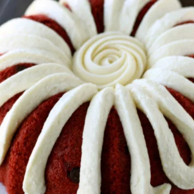 A delicious homemade Copycat Nothing Bundt Red Velvet Cake with cream cheese frosting.