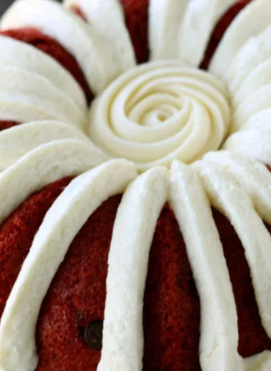 A delicious homemade Copycat Nothing Bundt Red Velvet Cake with cream cheese frosting.