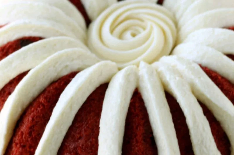A delicious homemade Copycat Nothing Bundt Red Velvet Cake with cream cheese frosting.