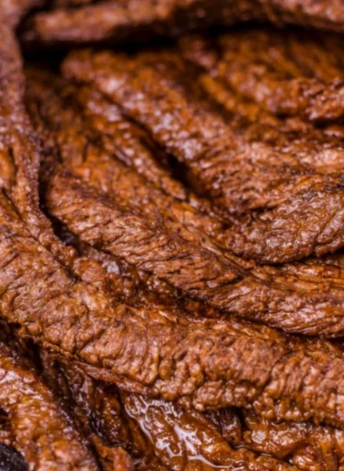 Juicy grilled beef steak served with aromatic herbs and spices.