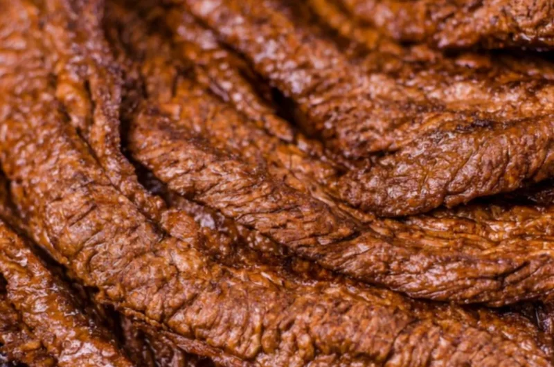 Juicy grilled beef steak served with aromatic herbs and spices.