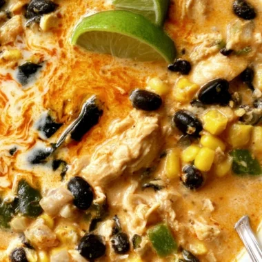 Bowl of easy chicken soup with poblano, black beans, and garnishes