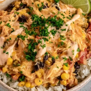 Plate of flavorful Festival Chicken with spices and garnishes