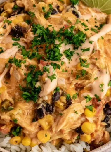 Plate of flavorful Festival Chicken with spices and garnishes