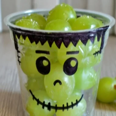 Colorful healthy Halloween snacks including fruits and vegetables