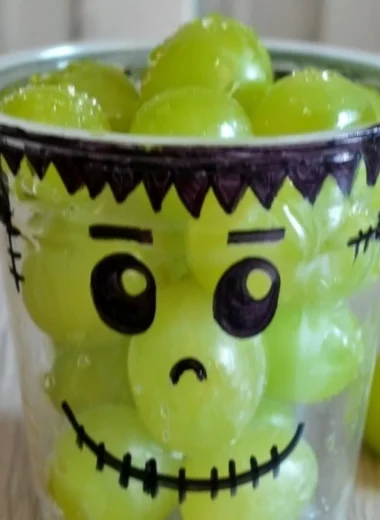 Colorful healthy Halloween snacks including fruits and vegetables