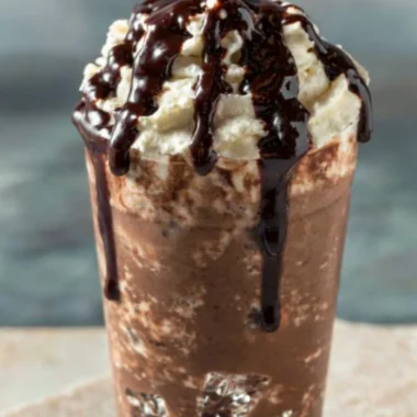 Delicious Iced Mocha Coffee in a glass with chocolate and whipped cream topping