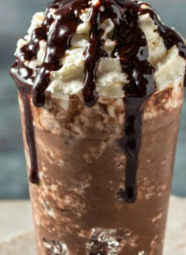 Delicious Iced Mocha Coffee in a glass with chocolate and whipped cream topping