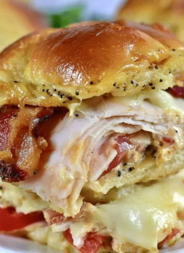 Delicious Kentucky Hot Brown Sliders served with melted cheese and toppings