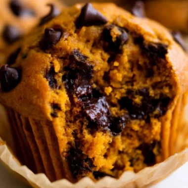 Delicious homemade pumpkin muffins on a rustic table