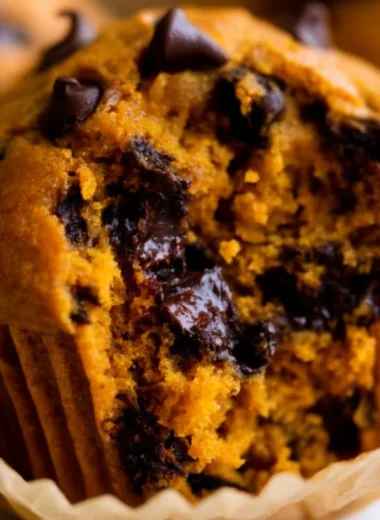 Delicious homemade pumpkin muffins on a rustic table