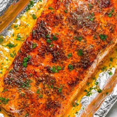 Delicious oven baked salmon with herbs and lemon on a plate