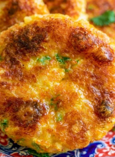 Crispy and golden Potato Cutlet served on a plate with dipping sauce