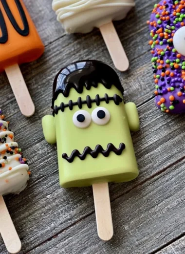 Colorful spooky Monster Cakesicles decorated for Halloween