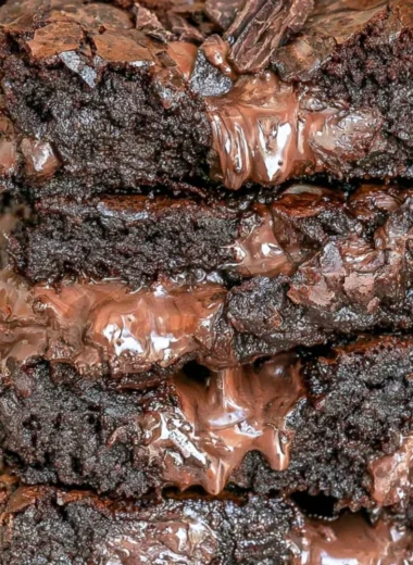 Delicious 100-calorie fudge brownies on a plate, perfect for dessert lovers