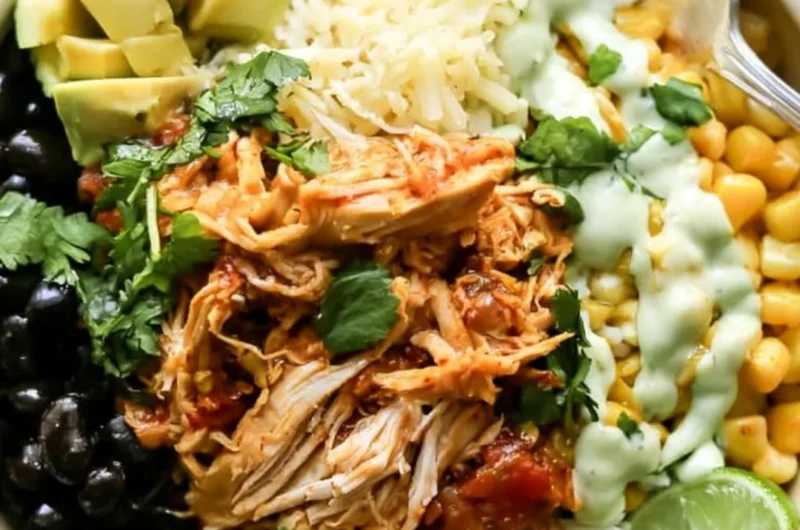 Cozy chicken burrito bowl filled with rice, beans, and fresh toppings