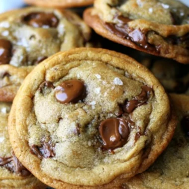 Plate of delicious brown butter chocolate chip cookies on a wooden table