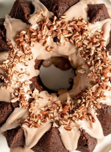 Cozy gingerbread bundt cake topped with maple cinnamon glaze, perfect for holidays.