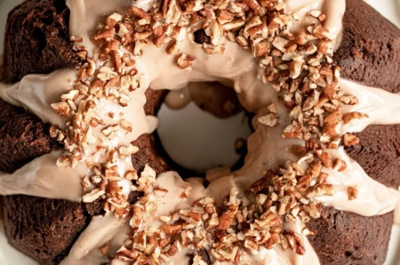 Cozy gingerbread bundt cake topped with maple cinnamon glaze, perfect for holidays.