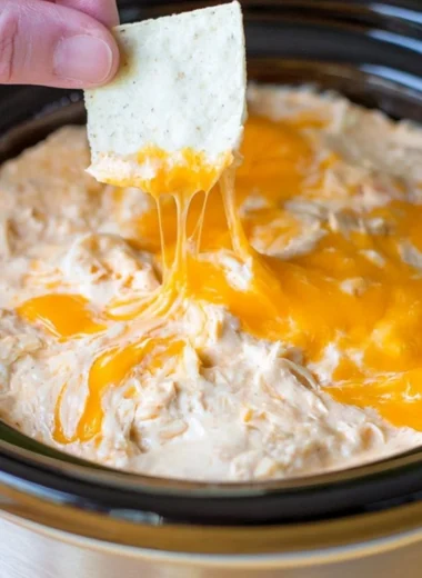 Delicious creamy Maryland crab dip served in a bowl with crackers