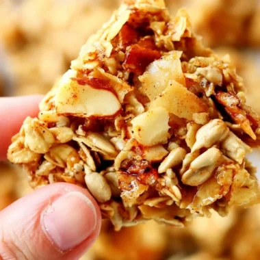 Bowl of crunchy granola with nuts and dried fruits