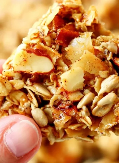 Bowl of crunchy granola with nuts and dried fruits