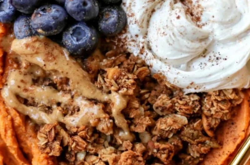 Fluffy sweet potato breakfast bowl topped with fruits and nuts for a nutritious meal.